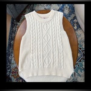 Medium cream colored cable knit sweater vest